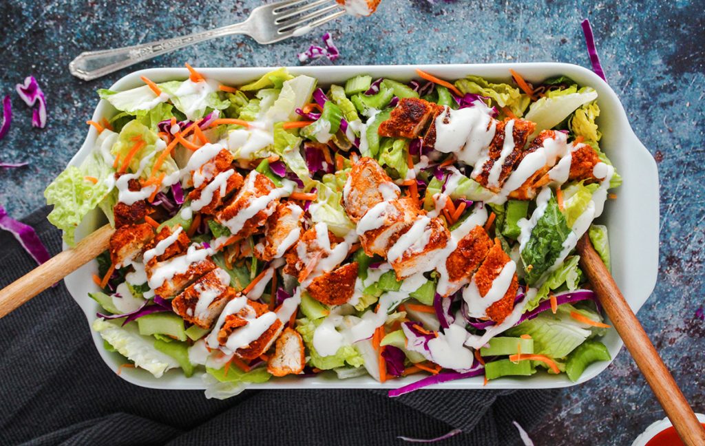 Buffalo chicken salad in serving dish.