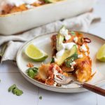 Black bean and rice enchiladas on a plate.
