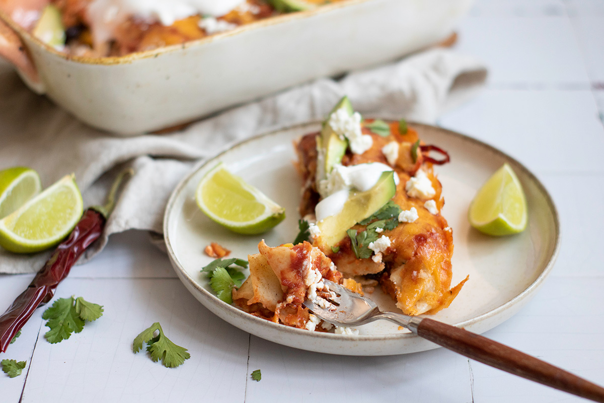 Black bean and rice enchiladas on a plate.