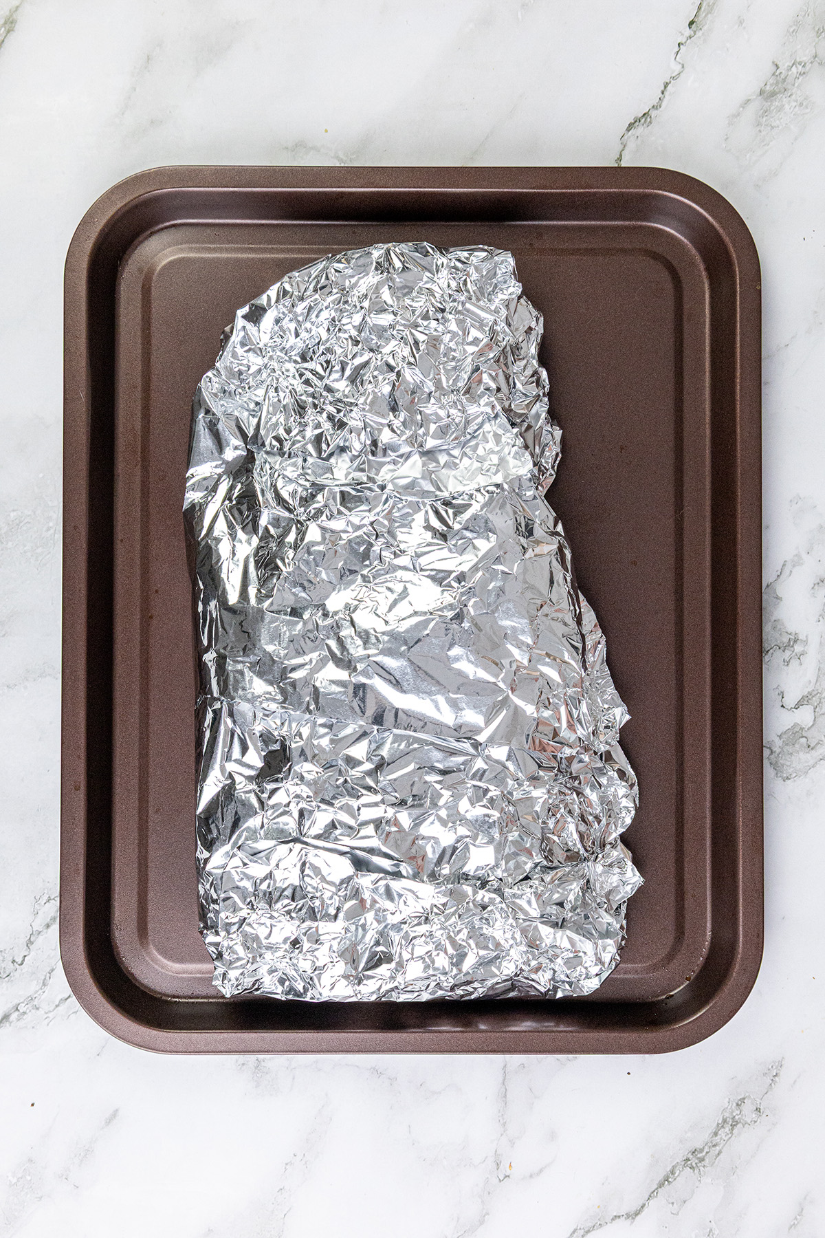 Chilean salmon wrapped in foil and ready to bake in the oven.