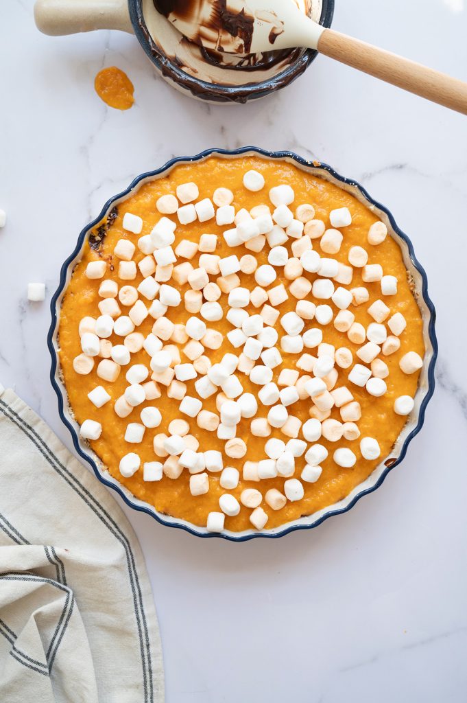 Mini marshmallows scattered over the unbaked sweet potato pie before going into the oven.