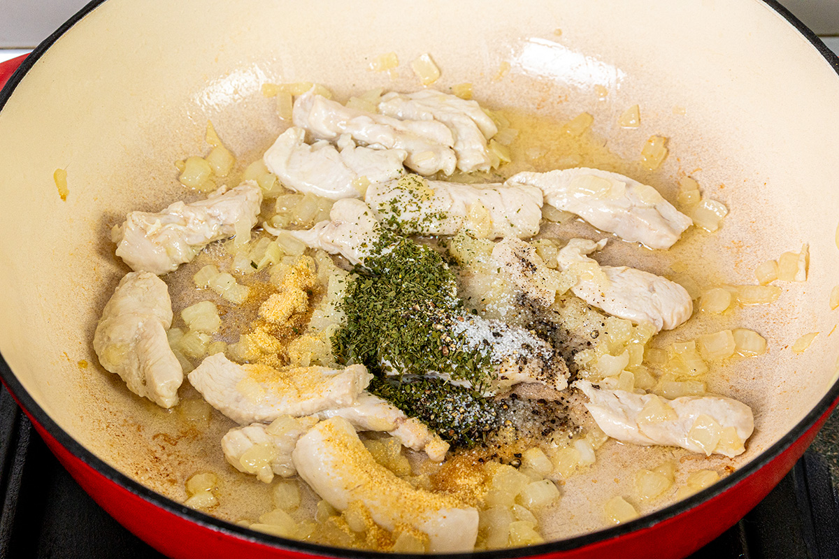 Chicken strips added to the sautéed onions with parsley, onion powder, salt, and pepper.