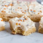 Close-up of a frosted Betty Crocker sugar cookie bar showing a soft and chewy texture.