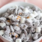 Close-up of chocolate peanut butter Crispix puppy chow coated in powdered sugar
