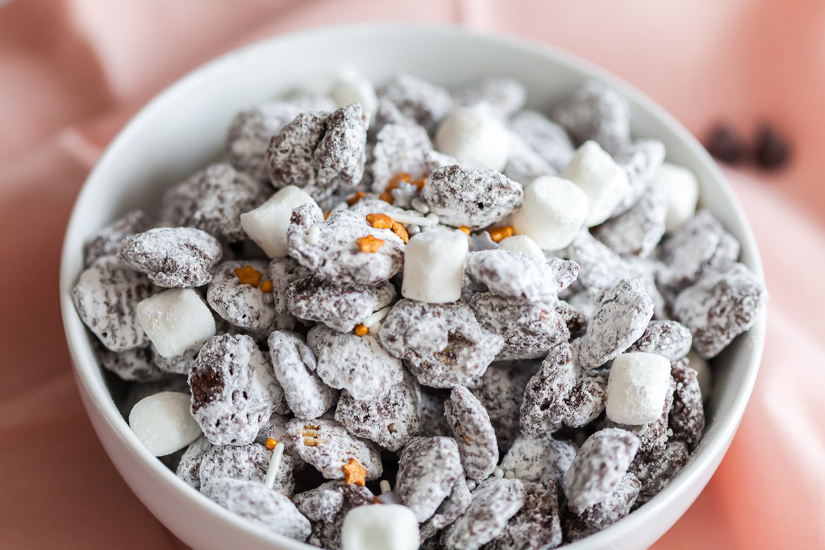 Close-up of chocolate peanut butter Crispix puppy chow coated in powdered sugar