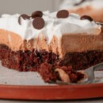 Close up of a French silk brownie with brownie mix featuring a dense chocolate brownie layer and smooth chocolate silk filling.