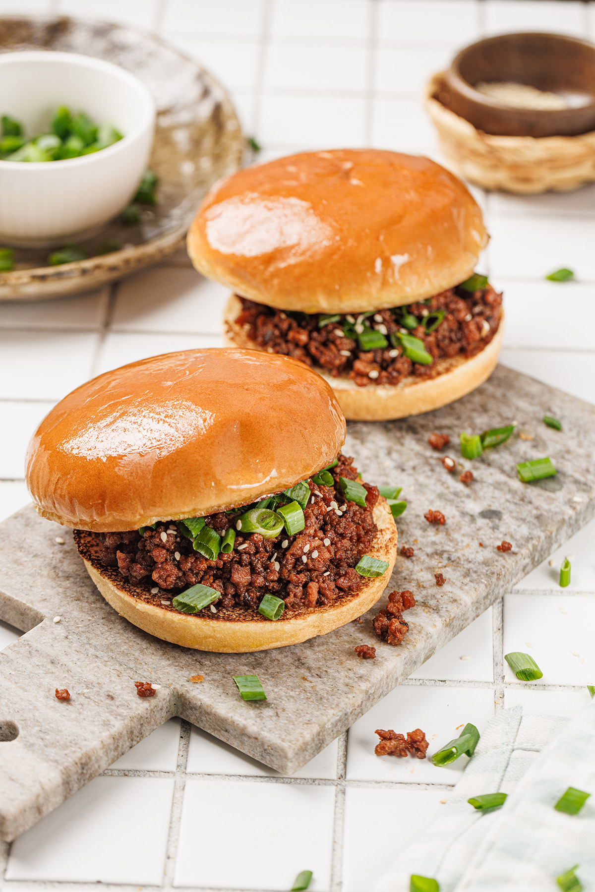 Close-up of Korean sloppy joes made with saucy ground beef, sesame seeds, and green onions.