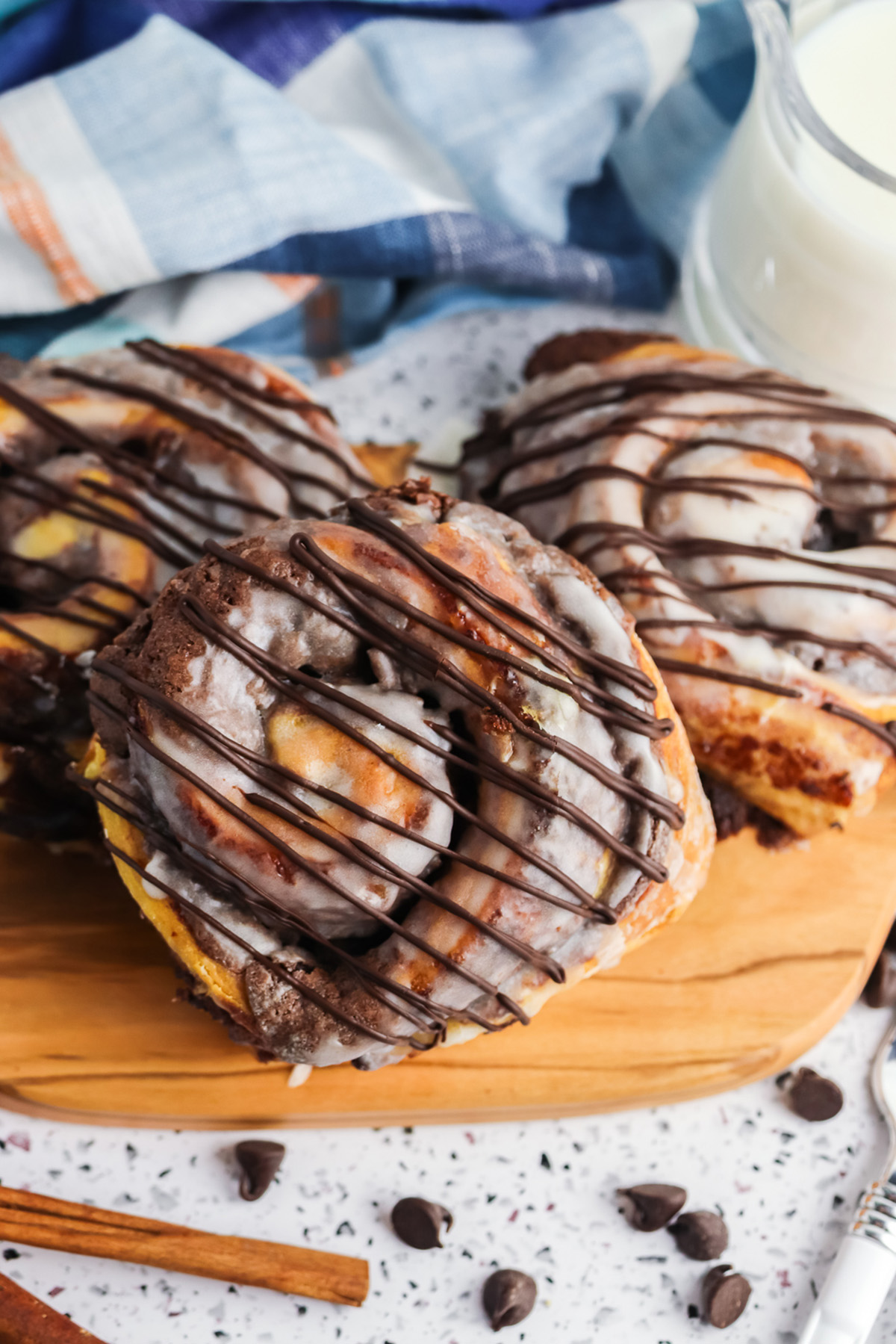 Close up of brownie cinnamon roll showing swirls of fudgy brownie batter baked inside cinnamon roll dough.