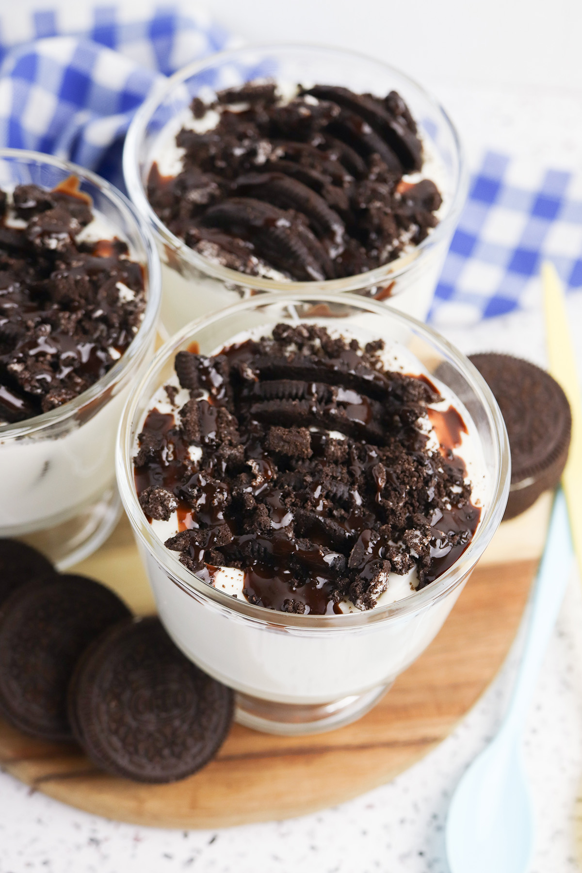 Easy oreo japanese cheesecake cups arranged on a wooden board.