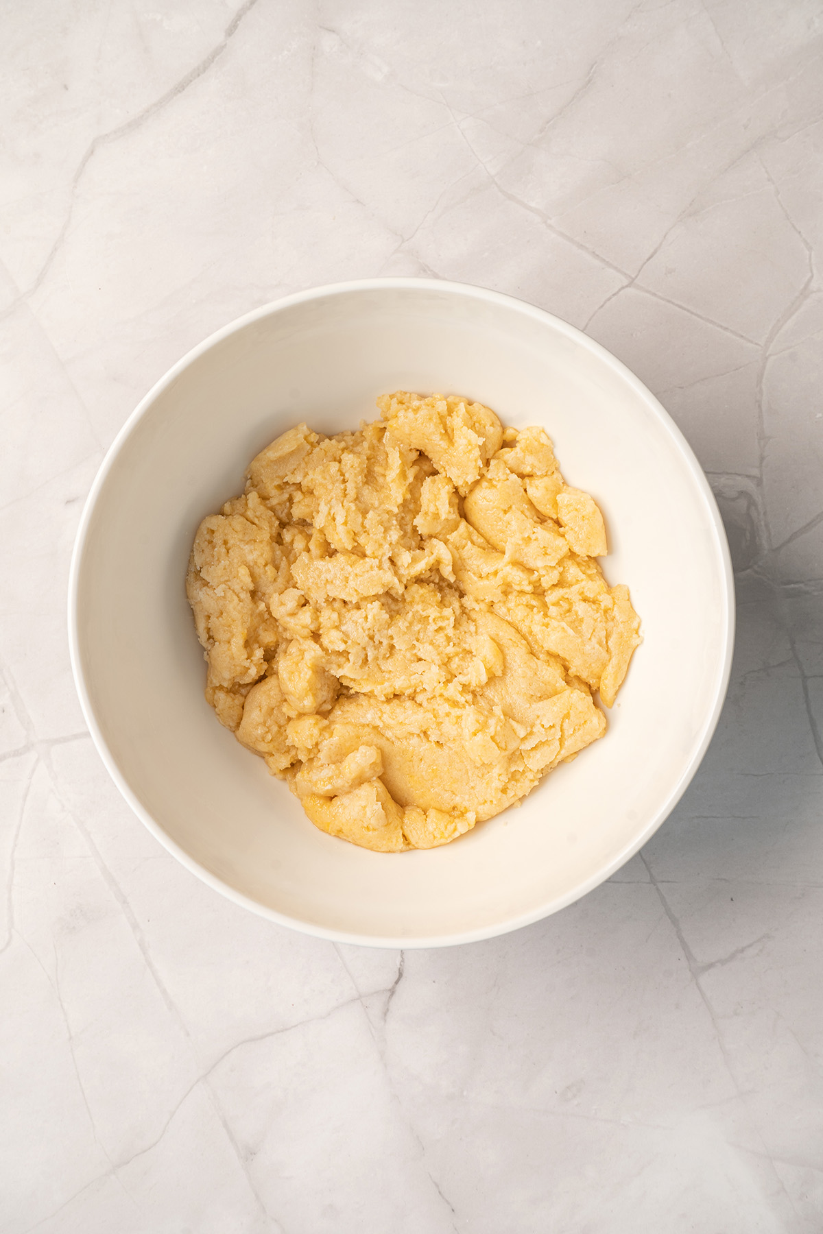 Easter cake mix cookie dough in a white mixing bowl.