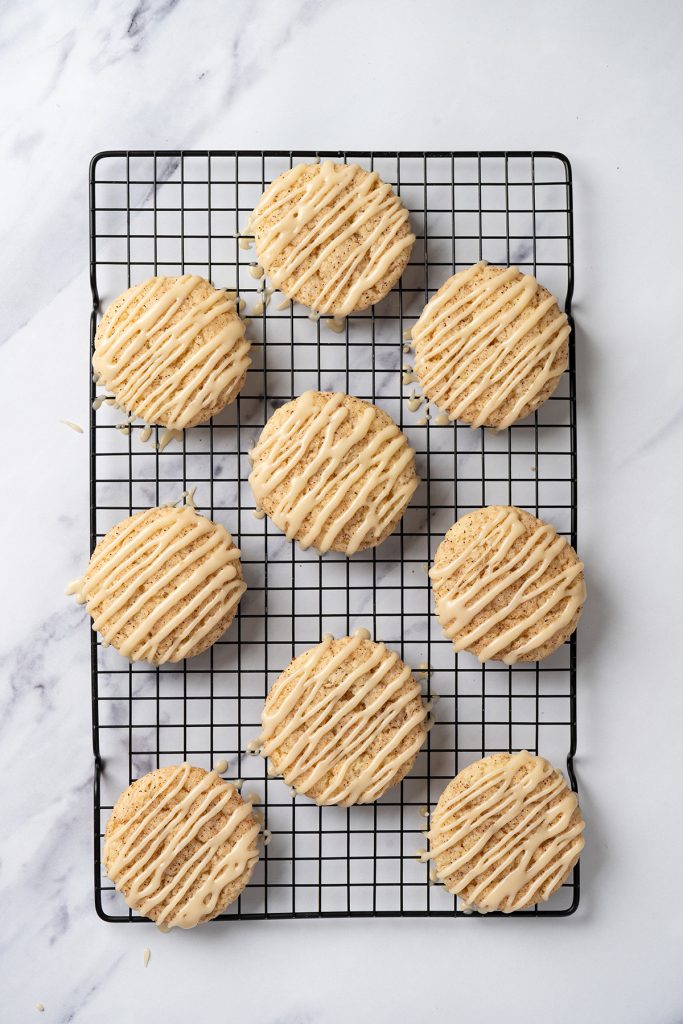 Cake mix churro cookies drizzled with caramel glaze on a wire cooling rack.