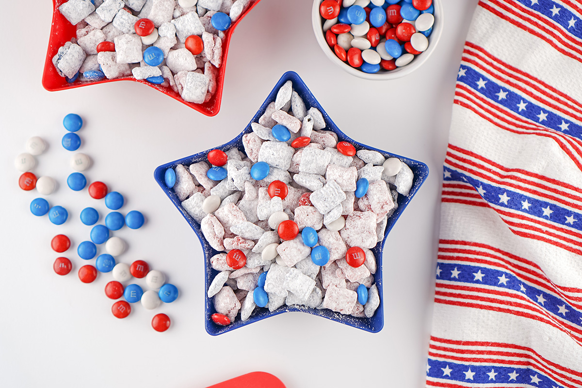 Red white and blue puppy chow served in a patriotic star bowl for summer holidays.