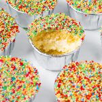 Viral dot cakes with rainbow sprinkles and creamy frosting filling.