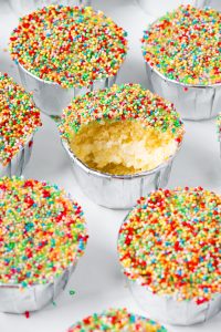 Viral dot cakes with rainbow sprinkles and creamy frosting filling.