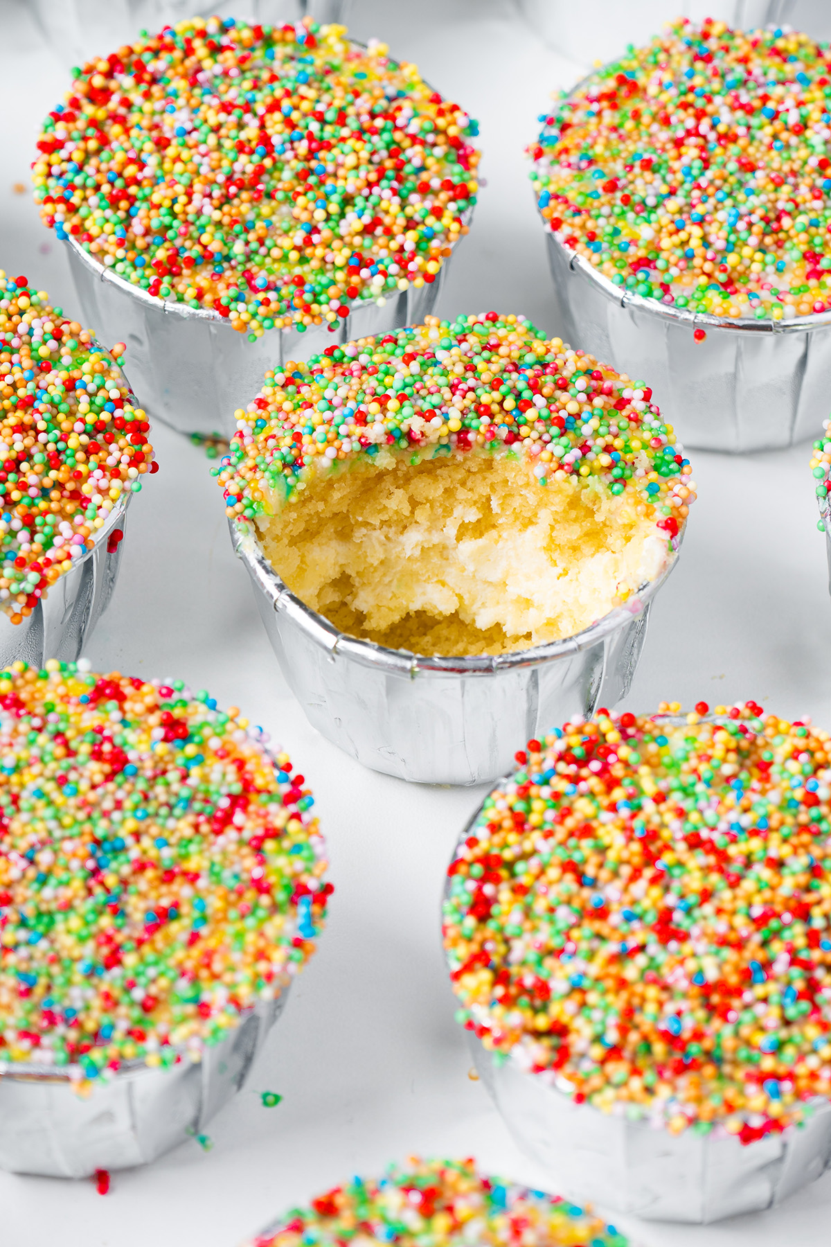 Viral dot cakes with rainbow sprinkles and creamy frosting filling.