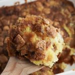 Close-up of a serving of Cinnamon Toast Crunch apple dump cake with apple filling and crunchy cinnamon cereal topping.